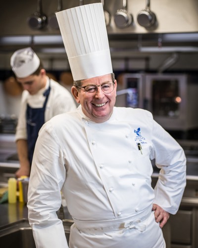 Head and shoulders portrait of John Williams MBE